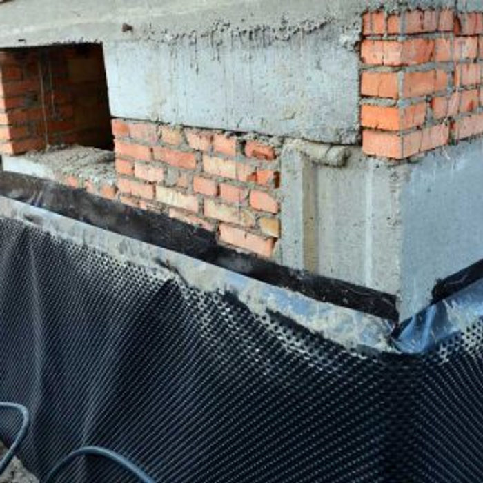 Exterior wall sealed with dimple membrane